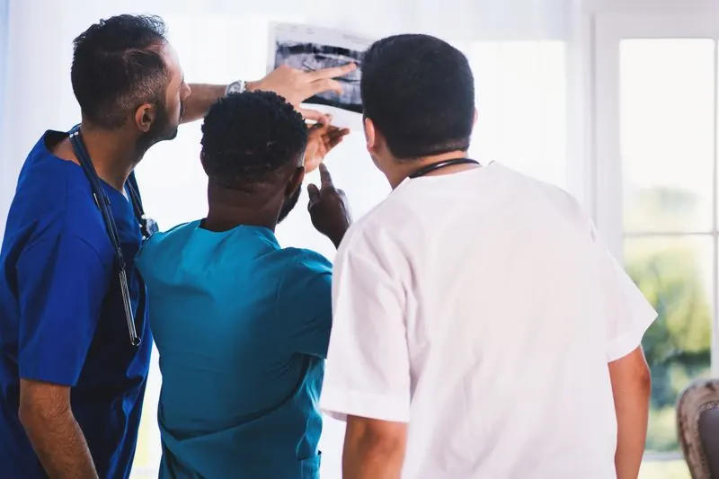Doctors reviewing treatment plans together